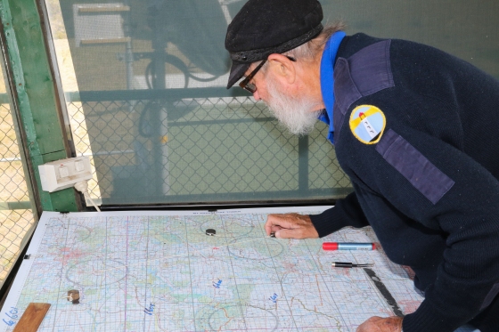Pat Howell looks at his fire spotting map
